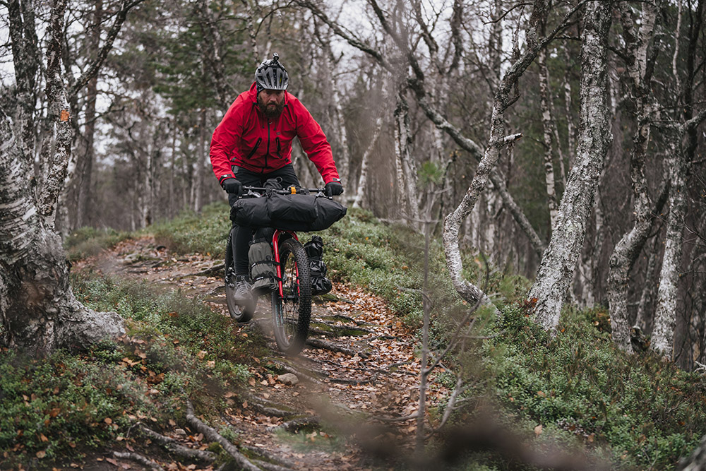 Erkki Punttila enjoying Lemmenjoki National Park. @Jaakko Posti / Kona Bikes