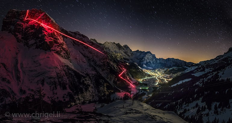 Wingsuit BASE jumping at night with a torch