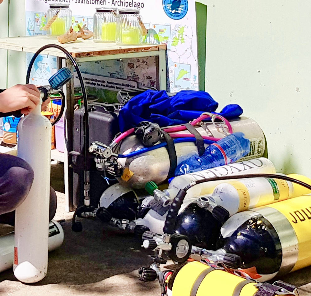 Filling cylinders on location in preparation to explore the Vrouw Maria on the anniversary dive.